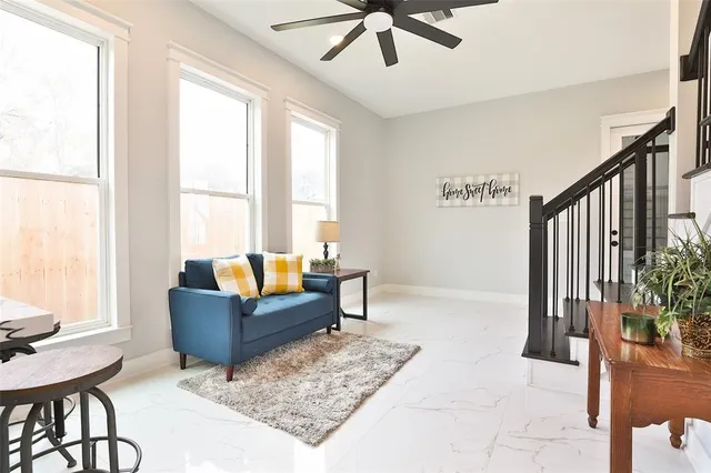 a living room with furniture and a window