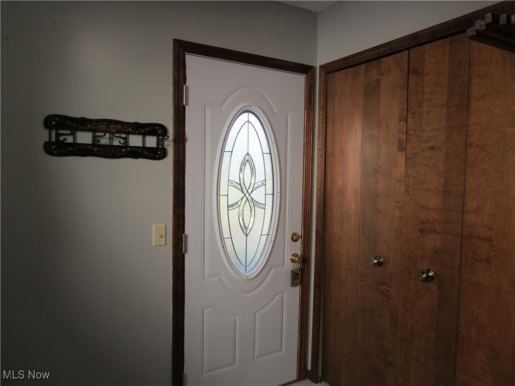 1120 Vincent Road Southeast North Canton, OH 44720 - Photo 49 of 50 Rear Entry door from the deck into the Laundry/Mud Room