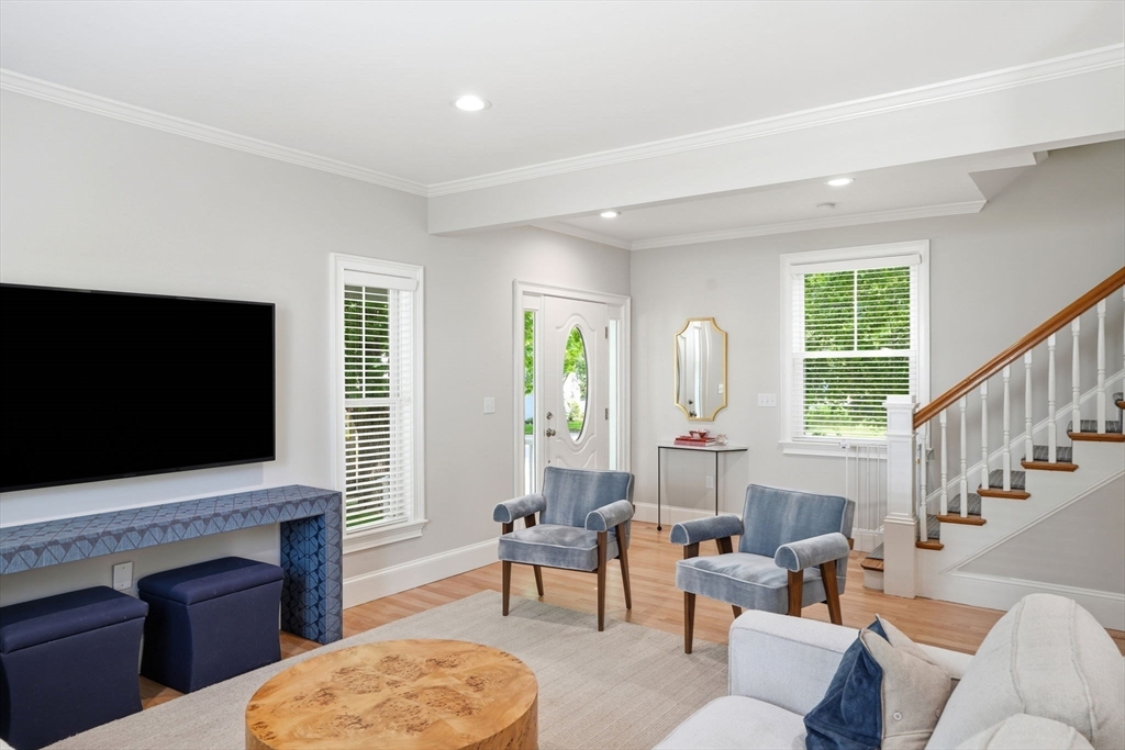 59 Elm Street Hingham, MA 02043 - Photo 6 of 33 a living room with fireplace furniture and a flat screen tv