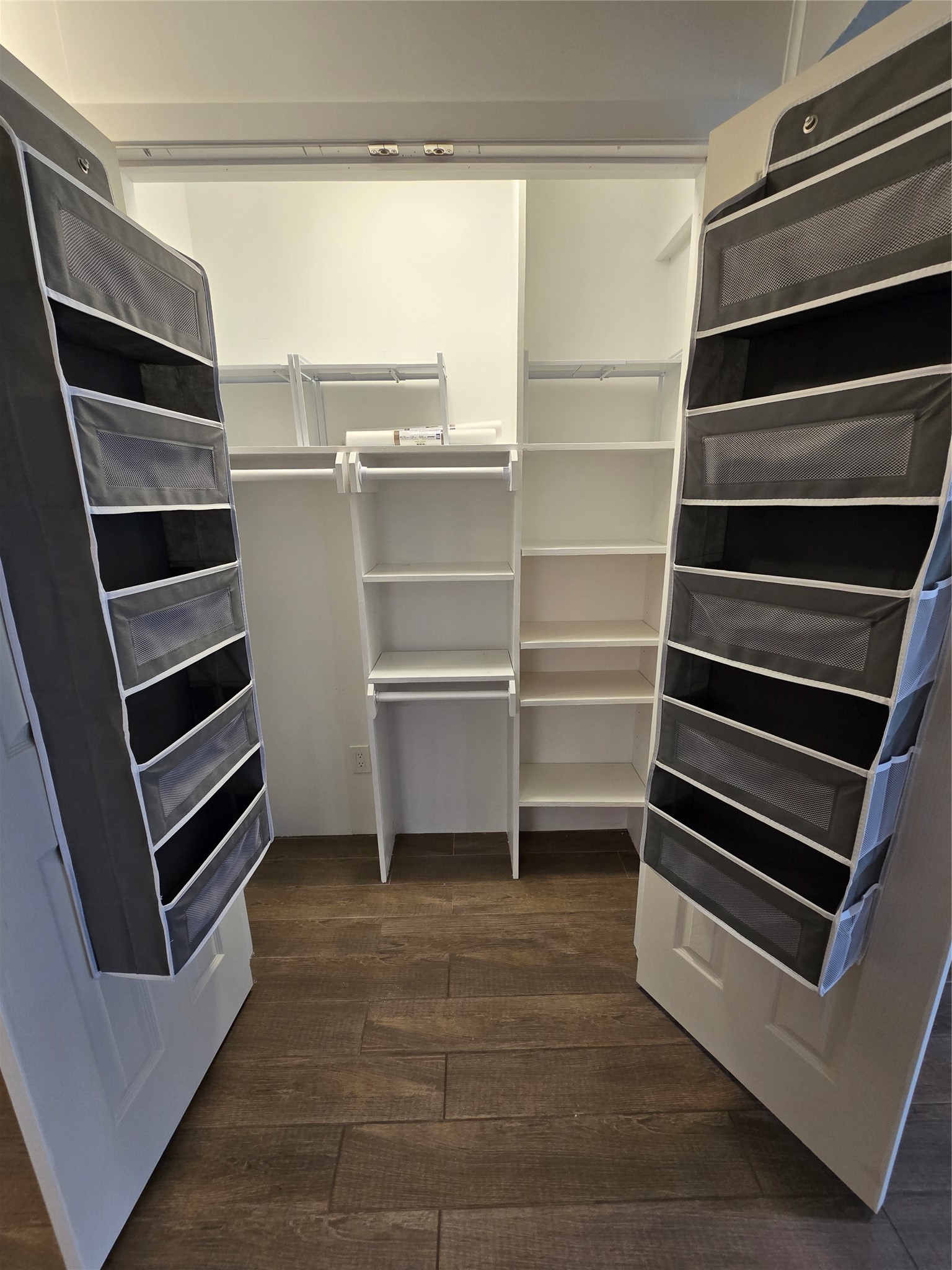 12900 Walden Road, Unit 415D Montgomery, TX 77356 - Photo 5 of 9 Custom built-in storage can function as extra closet space or pantry!