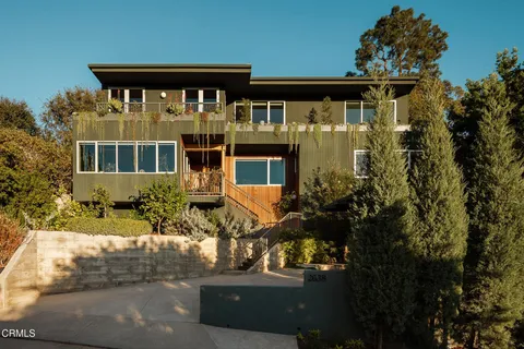 front view of a house with a small yard