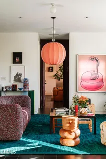 a bathroom with a toilet sink vanity and mirror