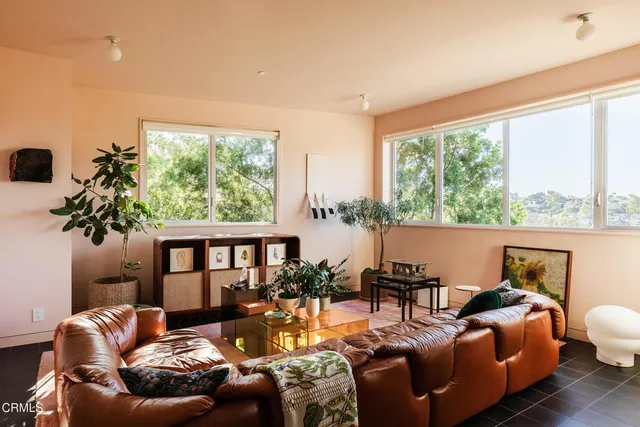 a bathroom with a bathtub and a window