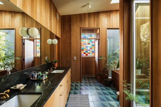 a room with furniture and a potted plant