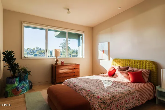 a bathroom with a toilet a sink and a mirror