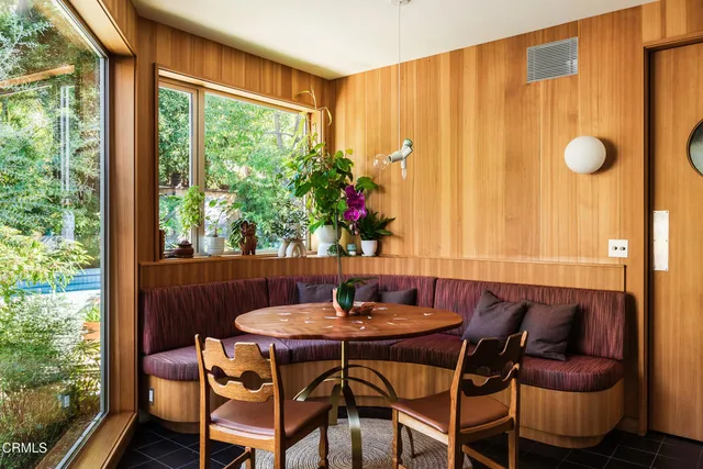 a room with lots of potted plants