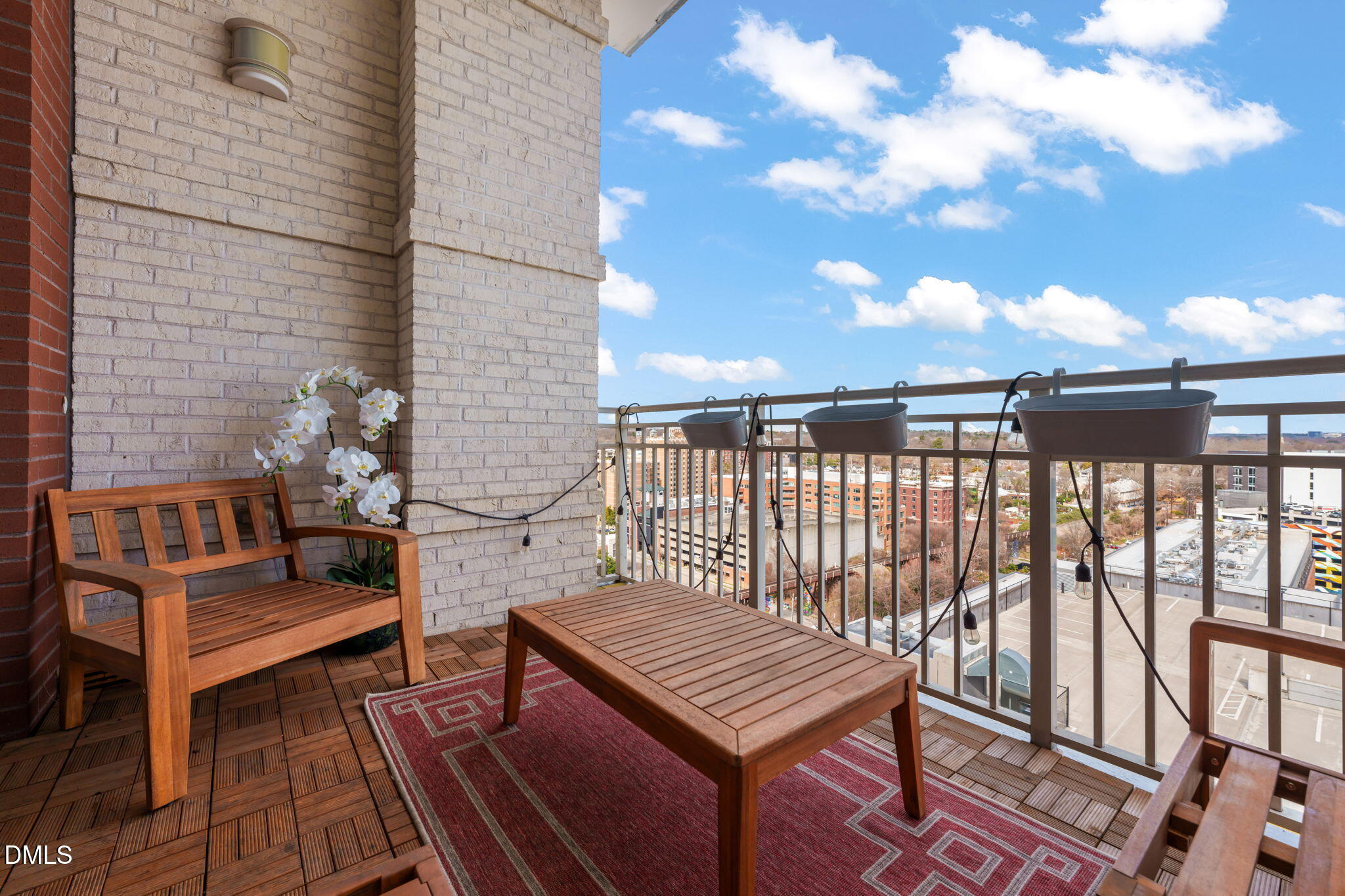 400 West North Street, Unit 1218 Raleigh, NC 27603 - Photo 28 of 41 a roof deck with wooden floor and fence