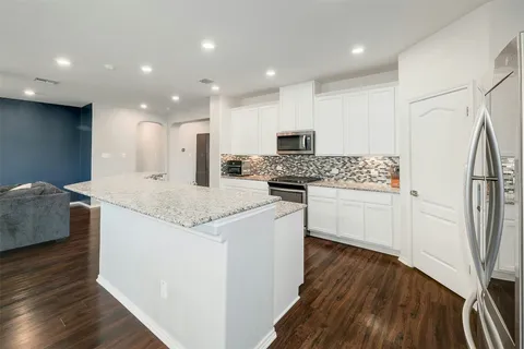 a living room with furniture fireplace and flat screen tv