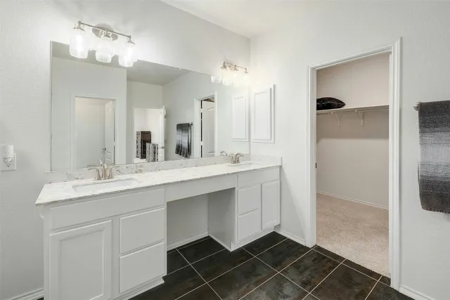 a bed room with a bed and a ceiling fan