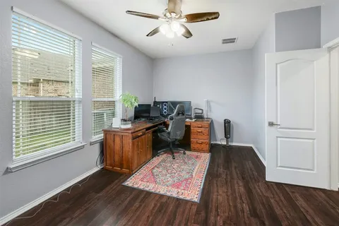 a bathroom with a double vanity sink a mirror and a shower