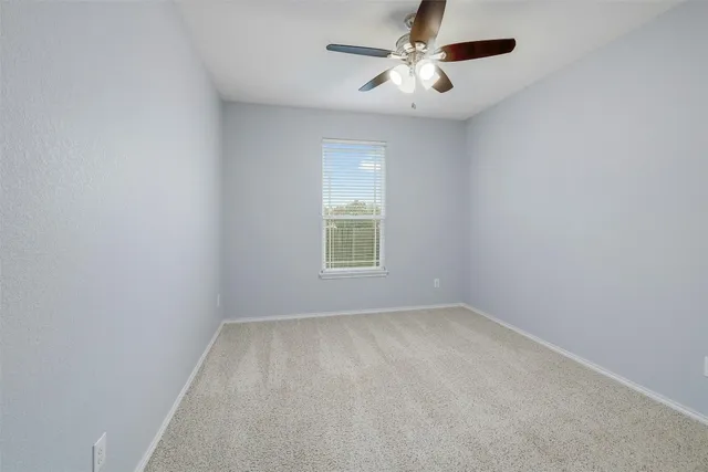 a view of gallery with wooden floor