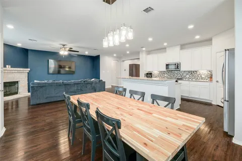 a view of a chair and tables in the balcony
