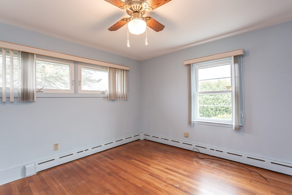 141 Kaufman Road Somerset, MA 02726 - Photo 13 of 26 a view of an empty room with wooden floor and a window
