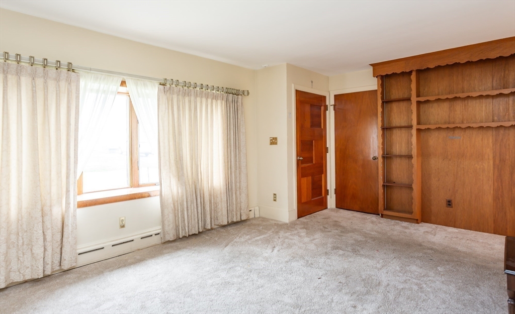 141 Kaufman Road Somerset, MA 02726 - Photo 8 of 26 a view of an empty room with a window