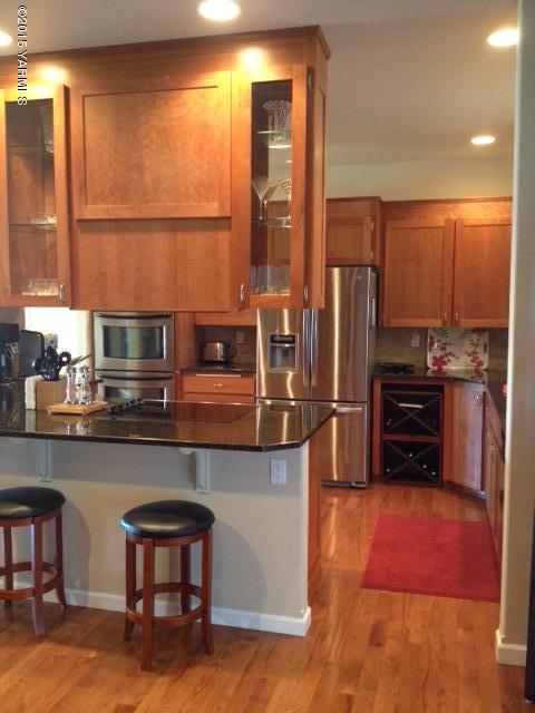 5305 Lombard Loop Road Zillah, WA 98953 - Photo 13 of 27 a kitchen with stainless steel appliances a sink and a refrigerator