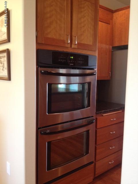 5305 Lombard Loop Road Zillah, WA 98953 - Photo 15 of 27 a stove top oven sitting inside of a kitchen