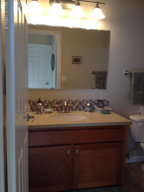 5305 Lombard Loop Road Zillah, WA 98953 - Photo 23 of 27 a bathroom with a sink and a mirror