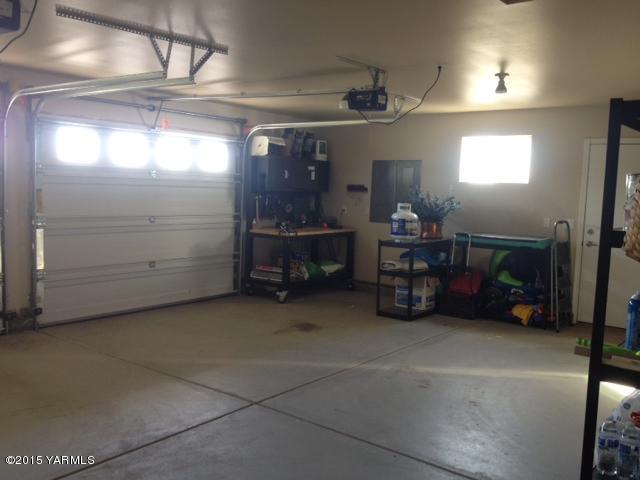 5305 Lombard Loop Road Zillah, WA 98953 - Photo 27 of 27 a room with furniture and a chandelier