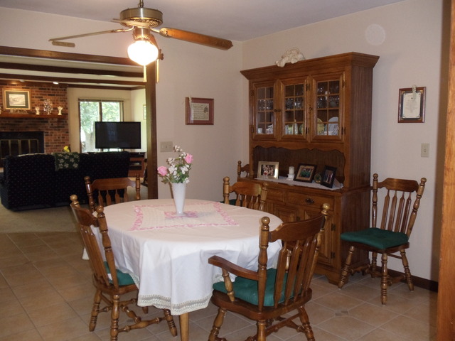 149 Swanson Road Sycamore, IL 60178 - Photo 3 of 22 a view of a dining room with furniture and a chandelier