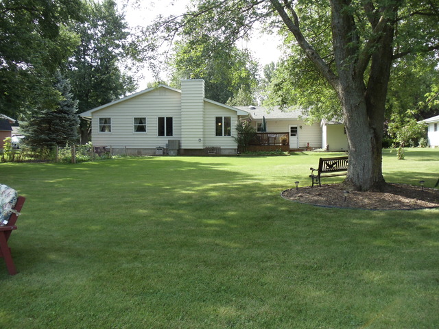 149 Swanson Road Sycamore, IL 60178 - Photo 21 of 22 a front view of a house with a garden