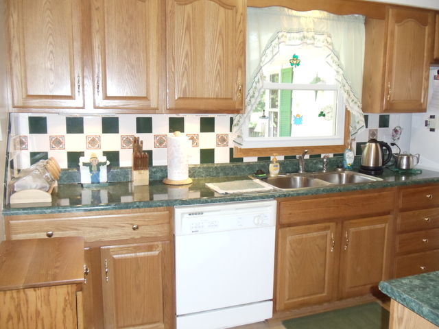 149 Swanson Road Sycamore, IL 60178 - Photo 4 of 22 a kitchen with stainless steel appliances granite countertop a sink and a cabinets