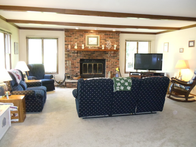 149 Swanson Road Sycamore, IL 60178 - Photo 7 of 22 a living room with furniture and a flat screen tv