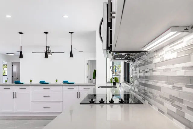 a bathroom with double vanity sink a mirror and shower