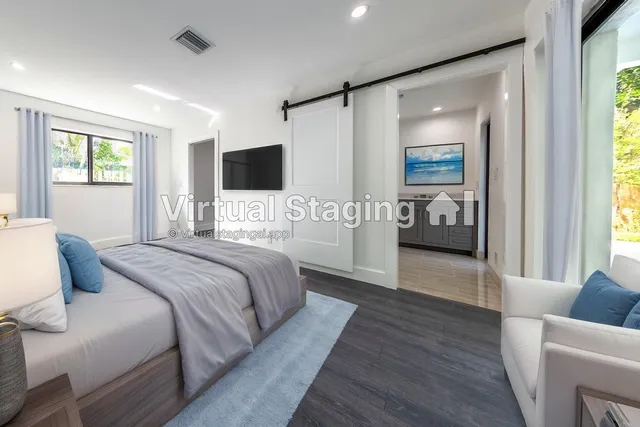 a bedroom with a large bed and a couch