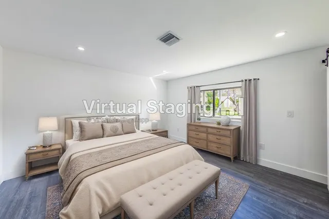 a bed room with a bed and a window