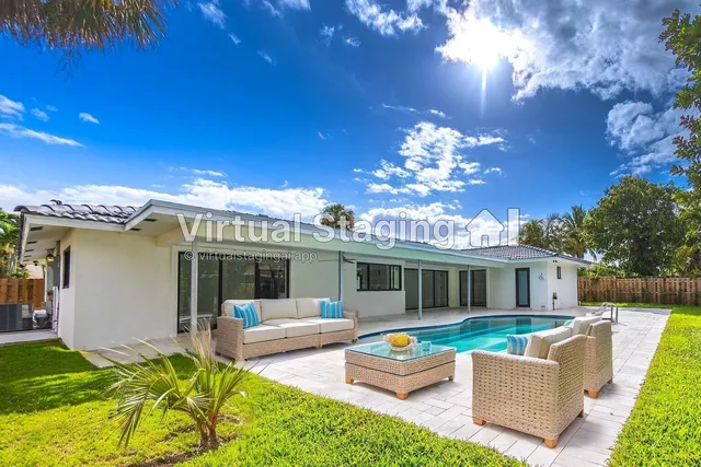 a view of a house with swimming pool and a yard