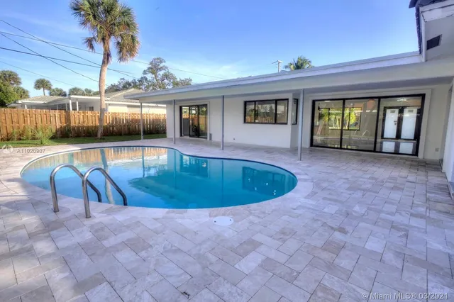a view of swimming pool with seating space
