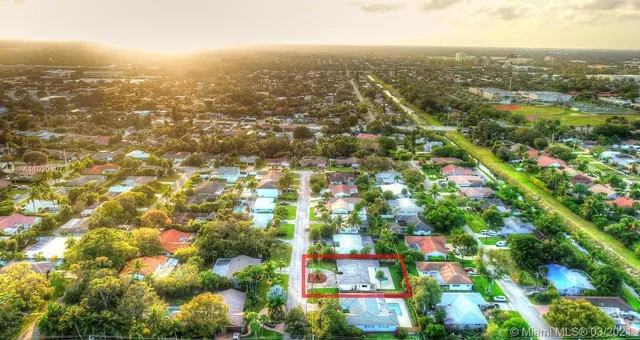an aerial view of residential building with green space