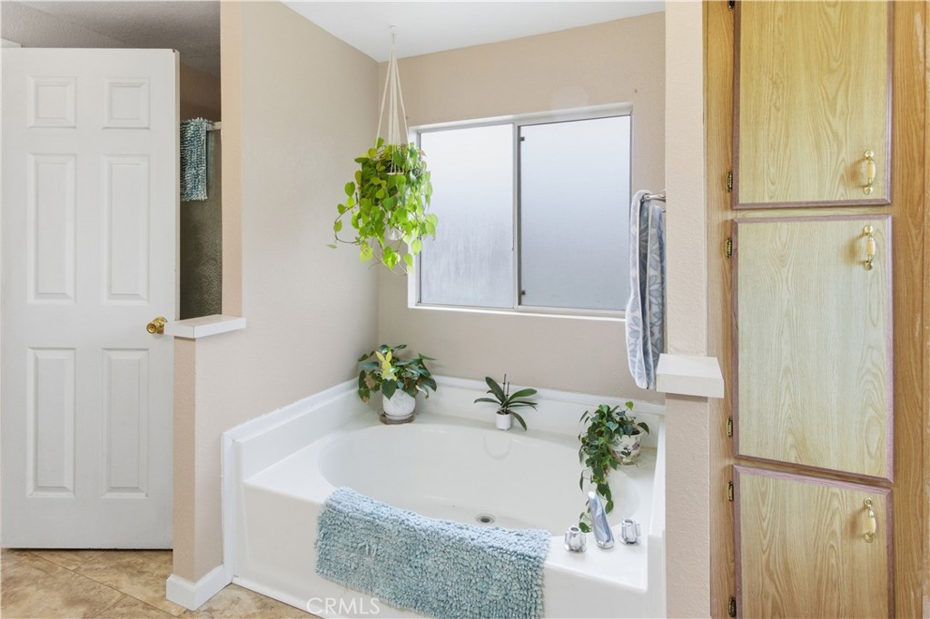 7156 North Winton Way Winton, CA 95388 - Photo 14 of 27 a white bath tub with a shower