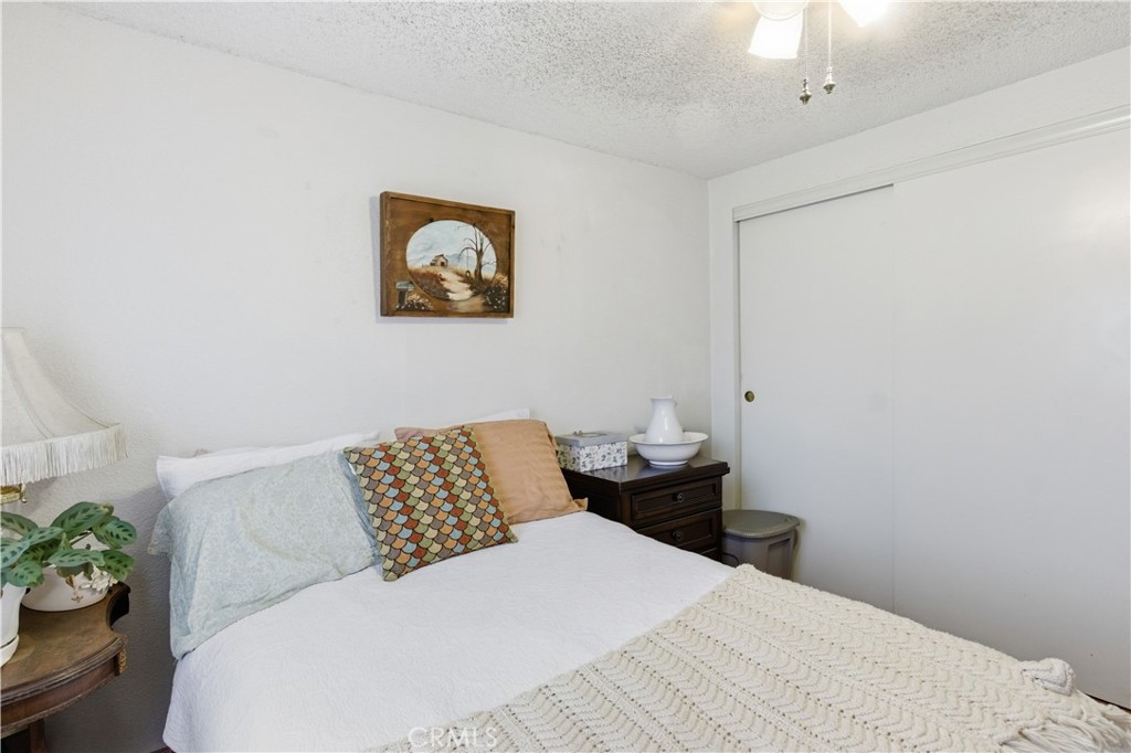 7156 North Winton Way Winton, CA 95388 - Photo 18 of 27 a bedroom with a bed and a couch