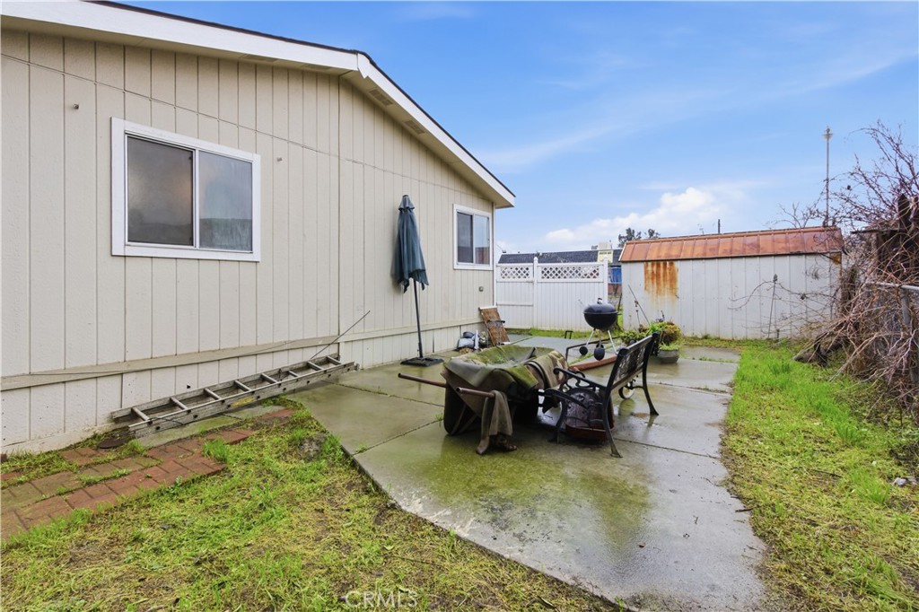7156 North Winton Way Winton, CA 95388 - Photo 19 of 27 a view of a patio with table and chairs near a yard
