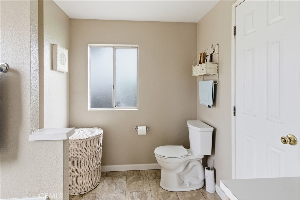 7156 North Winton Way Winton, CA 95388 - Photo 22 of 27 a bathroom with a toilet and a mirror