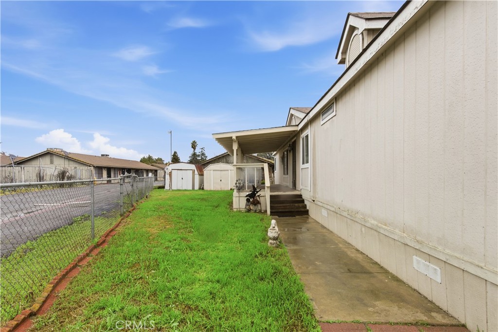 7156 North Winton Way Winton, CA 95388 - Photo 25 of 27 a view of a house with a yard and sitting area