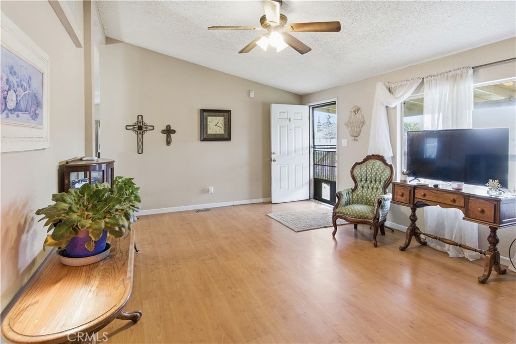 7156 North Winton Way Winton, CA 95388 - Photo 4 of 27 a living room with furniture and a flat screen tv