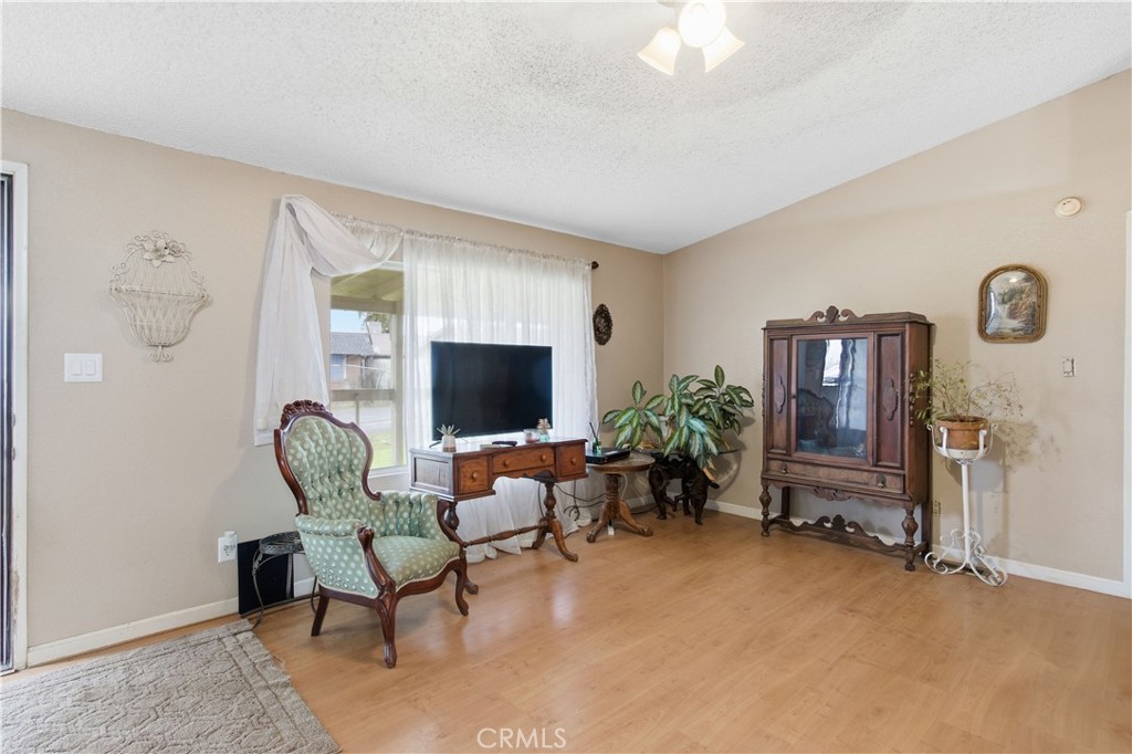 7156 North Winton Way Winton, CA 95388 - Photo 5 of 27 a living room with furniture and a flat screen tv