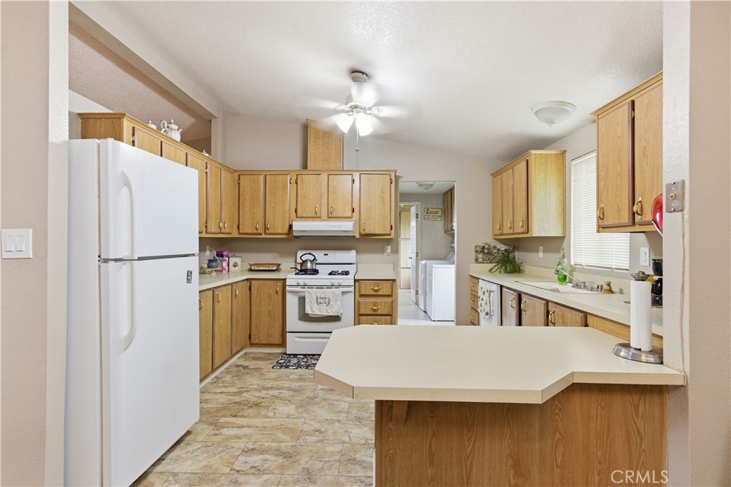 7156 North Winton Way Winton, CA 95388 - Photo 9 of 27 a kitchen with stainless steel appliances a refrigerator sink and cabinets
