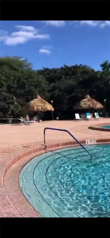 a view of swimming pool from a yard