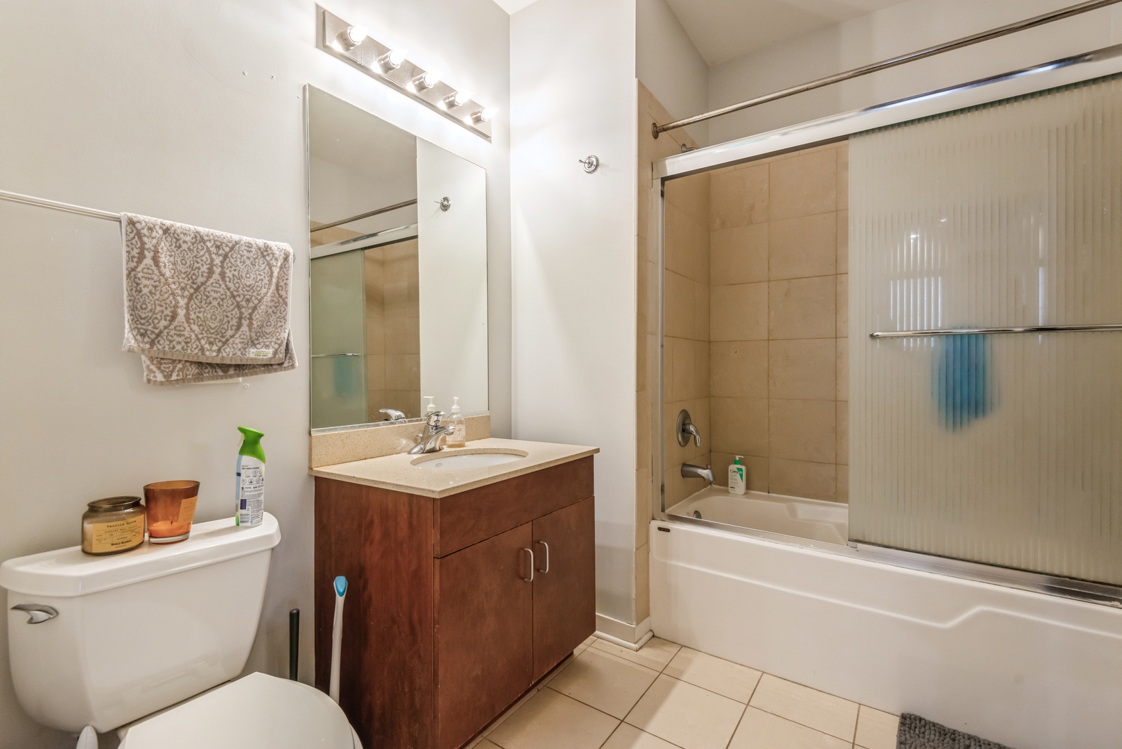 1022 South Racine Avenue, Unit 201 Chicago, IL 60607 - Photo 12 of 13 a bathroom with a sink toilet vanity and shower