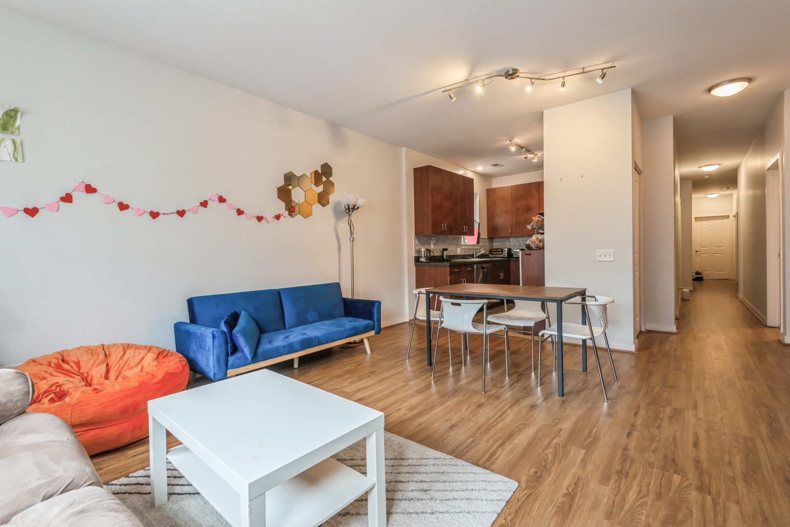 1022 South Racine Avenue, Unit 201 Chicago, IL 60607 - Photo 5 of 13 a living room with furniture and wooden floor