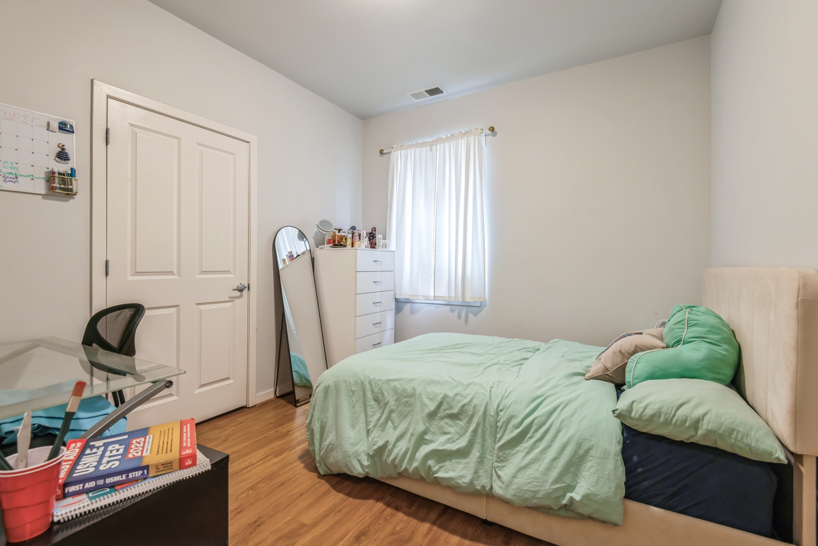 1022 South Racine Avenue, Unit 201 Chicago, IL 60607 - Photo 10 of 13 a bedroom with a bed and a window