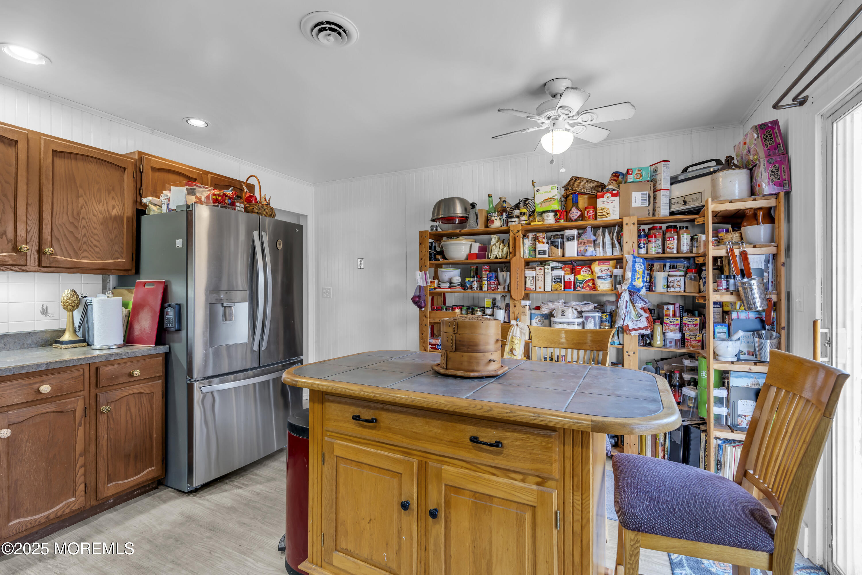 510 Cedar Swamp Road Jackson, NJ 08527 - Photo 13 of 27 a kitchen with stainless steel appliances granite countertop a dining table and chairs