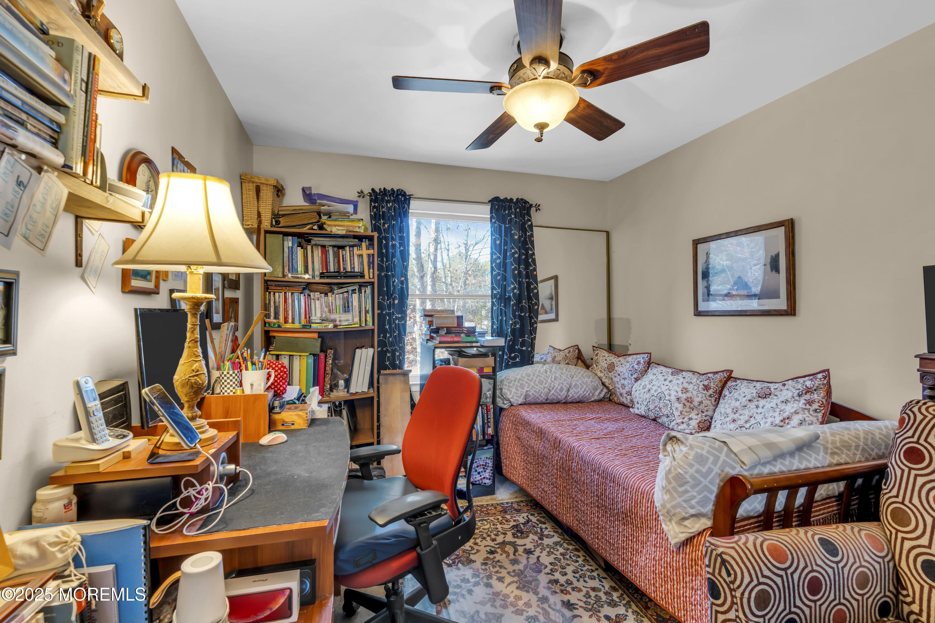 510 Cedar Swamp Road Jackson, NJ 08527 - Photo 17 of 27 a living room with furniture a flat screen tv and a ceiling fan