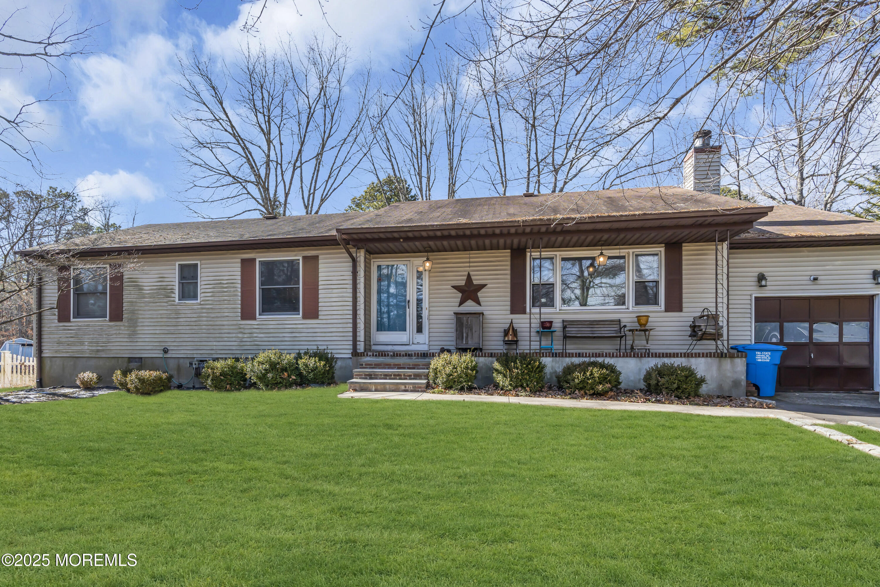510 Cedar Swamp Road Jackson, NJ 08527 - Photo 3 of 27 a front view of a house with a garden and trees