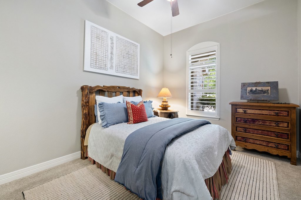 108 Berry Cove Georgetown, TX 78628 - Photo 22 of 39 a bedroom with a bed and a window