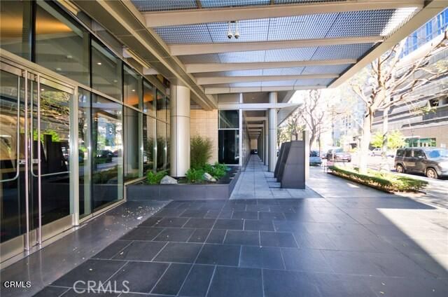a view of a balcony with couches and wooden floor