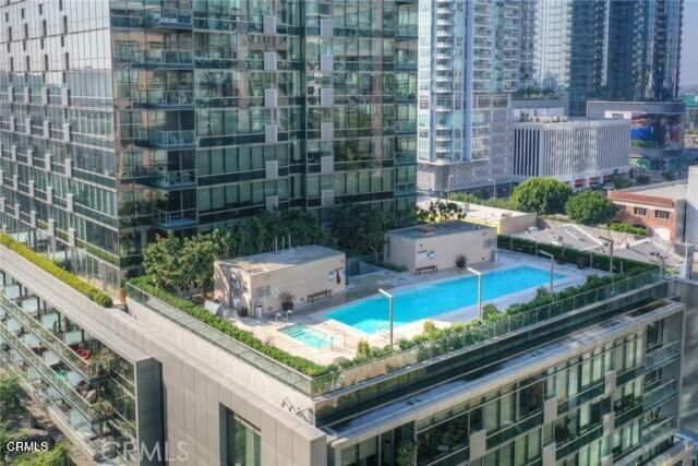 a view of swimming pool with outdoor seating